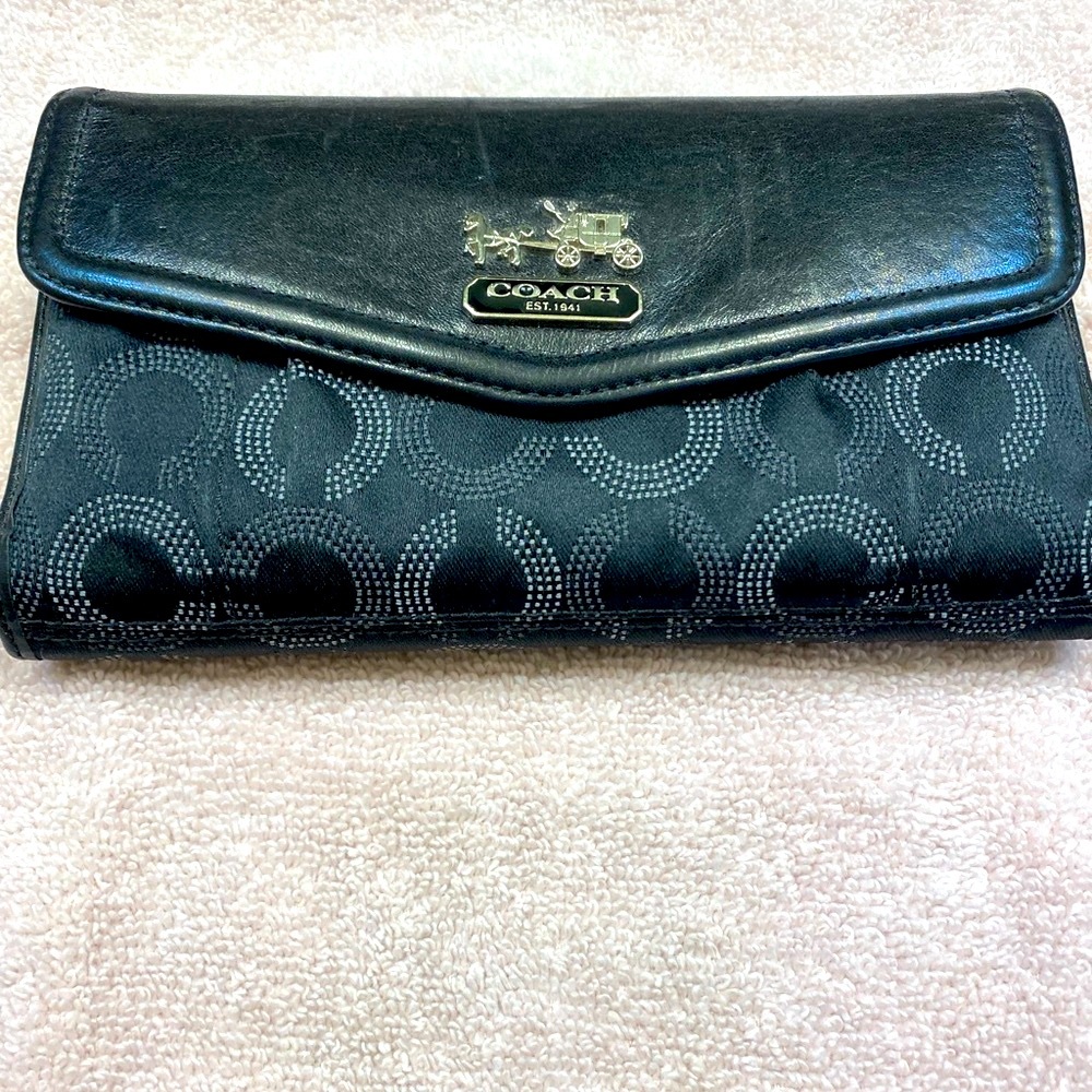 Black Coach wallet with check book that is removable.